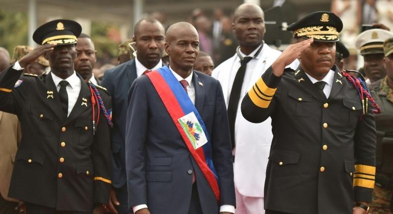 New Haitian President Jovenel Moise reviews and greets the troops during his inauguration ceremony at the National Palace, in Port-au-Prince, on February 7, 2017