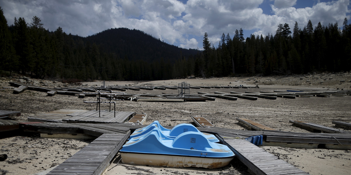 A dry boat dock sits in Huntington Lake after the water receded, in the High Sierra, California.