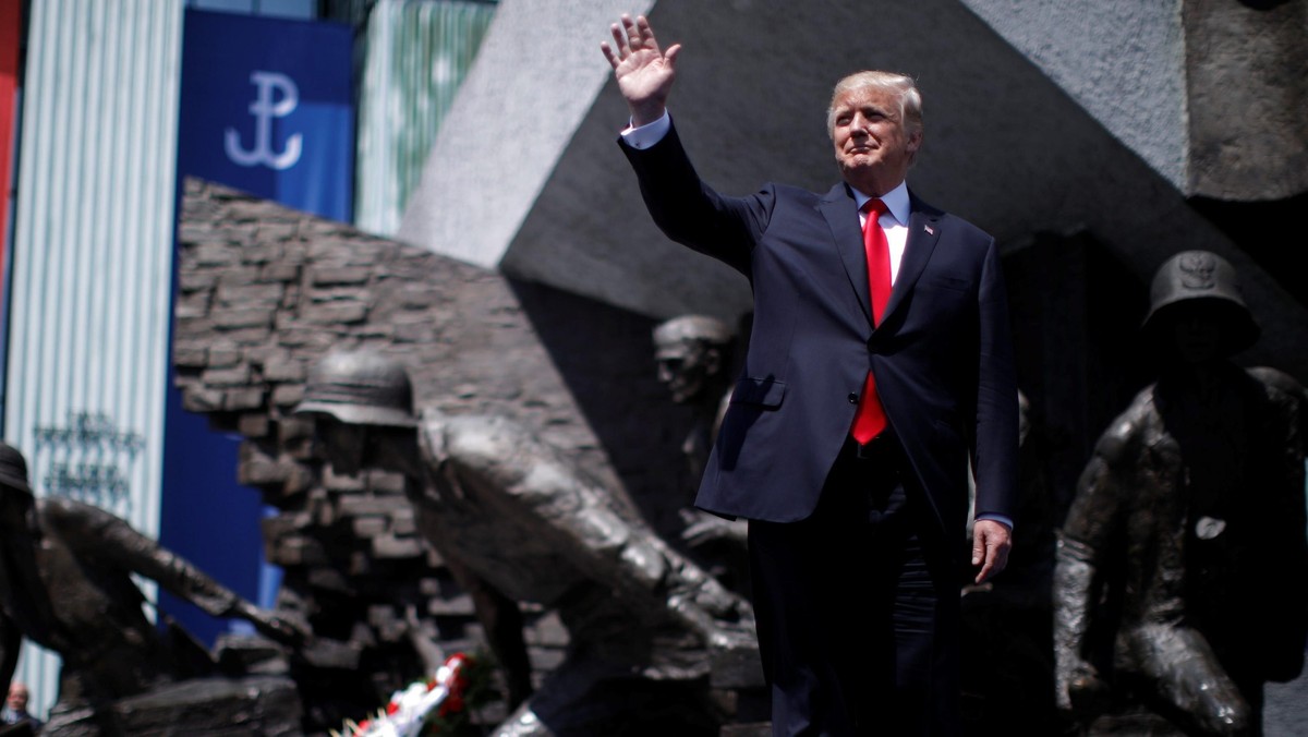 U.S. President Donald Trump waves as he arrives to hold a public speech in front of the Warsaw Upris