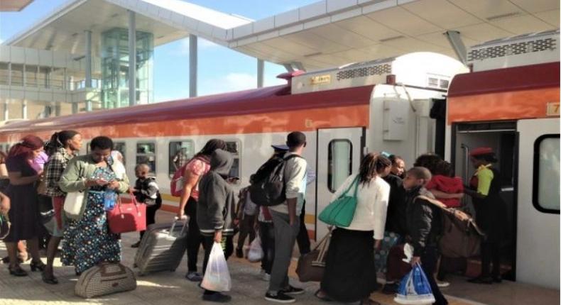 File image of passengers boarding a train