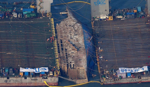 The sunken ferry Sewol is seen during its salvage operations at the sea off Jindo