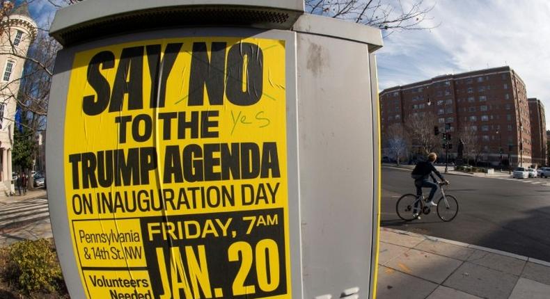 Street posters calling for protests are seen in the Dupont Circle area of Washington, DC, a week before the Inauguration of Donald Trump as US president