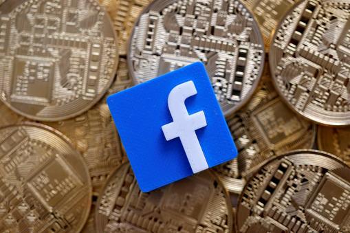 FILE PHOTO: Facebook logo is seen on representations of Bitcoin virtual currency in this illustration picture