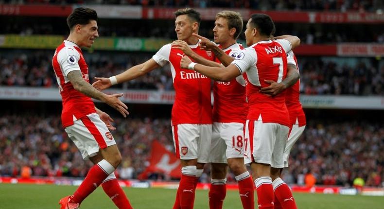 Arsenal's defender Hector Bellerin (L), seen celebrating a goal with teammates in September 2016, said he is really, really happy to have his contract extended with the English team