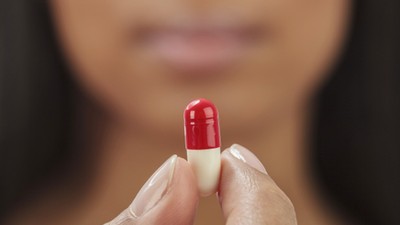 Woman Taking Pill