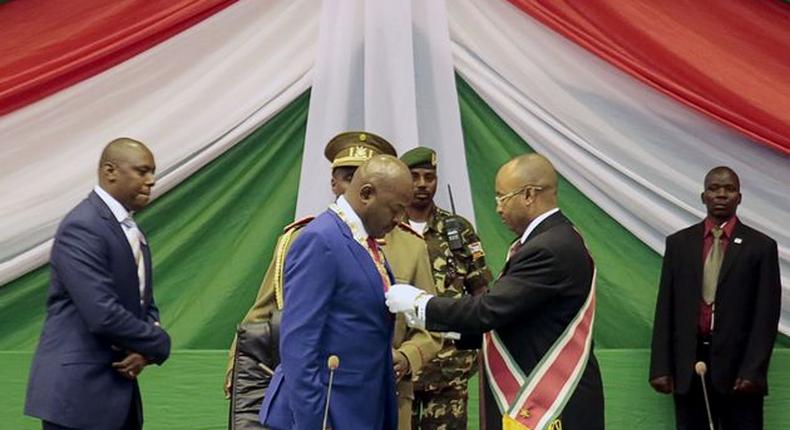 Burundi swears in new cabinet that some opponents condemn