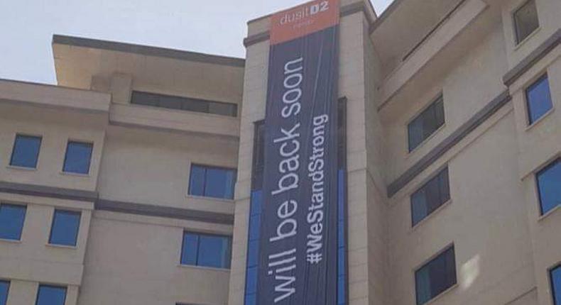 Banner draped over Dusit D2 Hotel after the facility was closed following a terror attack (Twitter)