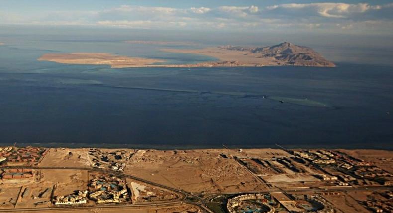 The Red Sea islands of Tiran (foreground) and Sanafir (background) are seen in the Strait of Tiran between Egypt's Sinai Peninsula and Saudi Arabia