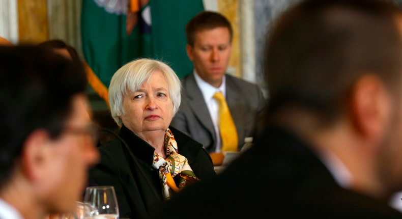 Chair of the Federal Reserve Janet Yellen listens to remarks during an open session meeting of the Financial Stability Oversight Council in the Cash Room of the Treasury in Washington December 18, 2014.