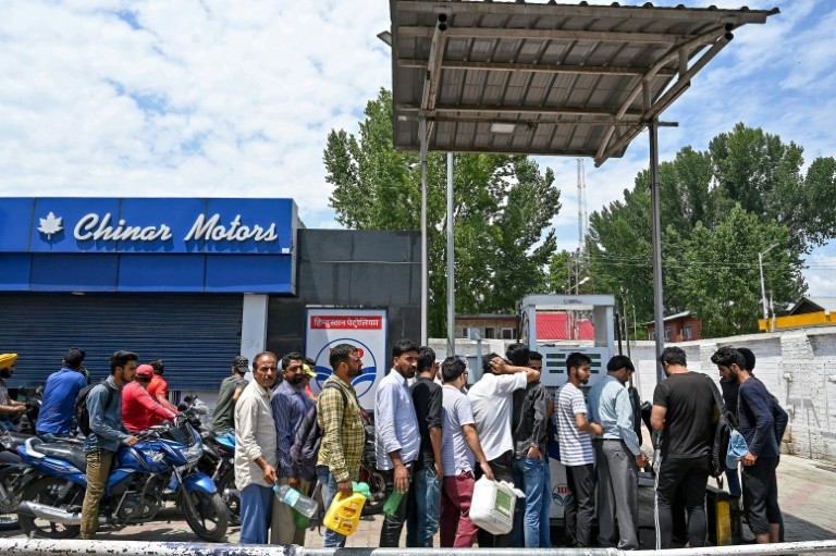 Kashmiri residents, concerned by a security warning, formed long lines outside petrol stations, food stores and bank cash machines