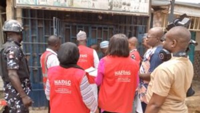 NAFDAC officials sealing a shop with unwholesome products in Suleja, Niger State.