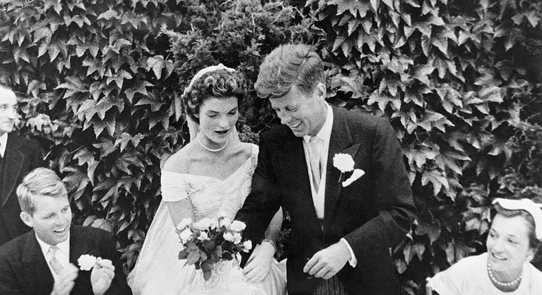 John F. Kennedy and Jacqueline Bouvier cutting their wedding cake after their marriage in Newport, Rhode Island.Bettmann/Getty Images