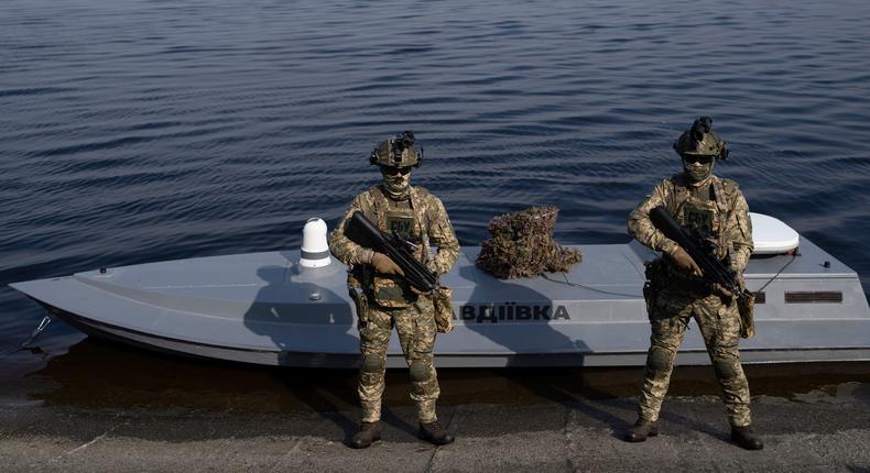 Ukrainian servicemen in front of a Sea Baby drone in the Kyiv region.AP Photo/Evgeniy Maloletka