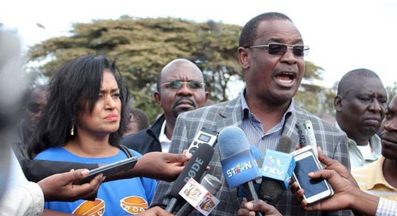 Nairobi Governor Dr Evans Kidero with Nairobi Weman Representative candidate Esther Passaris address the media after attending a church service at Regina Caeli Catholic Church in Karen.