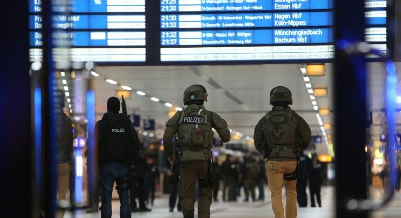 Special police commandos arrive at the main train station in Duesseldorf, western Germany, late on March 9, 2017 after at least nine people where injured by a man with an axe