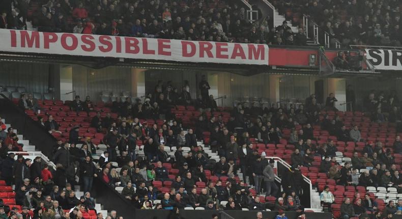 No hope: Manchester United fans left early during Wednesday's 2-0 defeat to Burnley