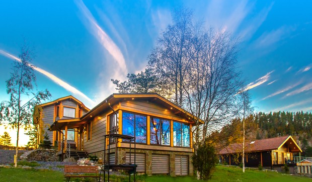 stock-photo-cottage-on-the-slope-cottage-village-house-with-large-windows-the-construction-of-the-mysterious-1028681041