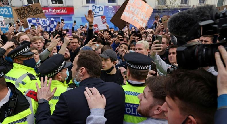 Chelsea's Petr Cech (3L) attempts to talk to supporters outside Stamford Bridge