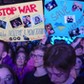 REFUSENIKS Spectators hold up posters during an antiwar concert by Russian musicians Noize MC and Monetochka in Warsaw, Poland, 2022