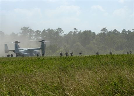 050616-N-1467R-033Camp Lejeune, N.C. (June 16, 2005) - An MV-22 Osprey, assigned to the ŇArgonautsÓ of Marine Tilt-Rotor Operational Test and Evaluation Squadron Two Two (VMX-22), conducts a tactical landing at Raven Landing Zone on board Camp Lejeune Marine Base. The MV-22 was conducting training operations with Marines assigned to 1st Battalion, 8th Marine Regiment, Platoon 1/8 currently embarked aboard the amphibious assault ship USS Bataan (LHD 5). Bataan is currently underway in the Atlantic Ocean completing the final test and evaluation for the MV-22 Osprey tilt-rotor aircraft. U.S. Navy photo by PhotographerŐs Mate Airman Pedro A. Rodriguez (RELEASED)