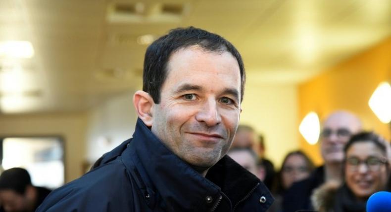 French former minister and candidate for the left-wing primaries, Benoit Hamon, poses at a polling station on January 22, 2017 in Trappes, southwest of Paris