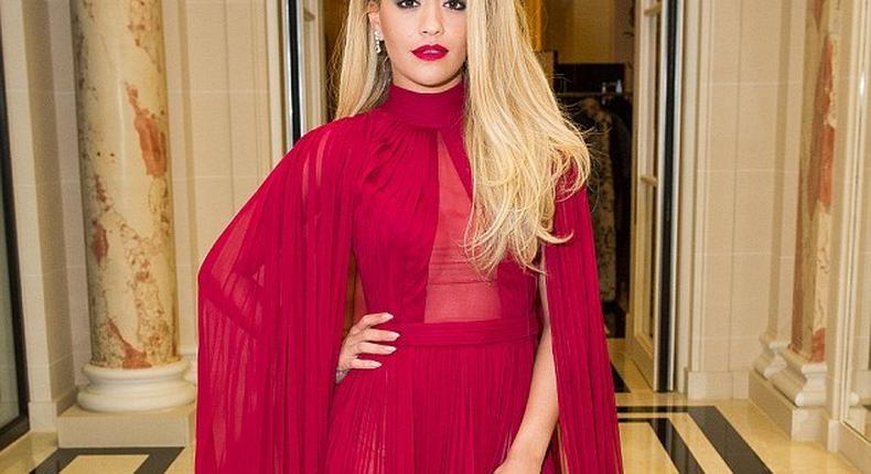 Rita Ora chose a red caped dress with thigh high slit for the Ralph & Russo's Chopard event