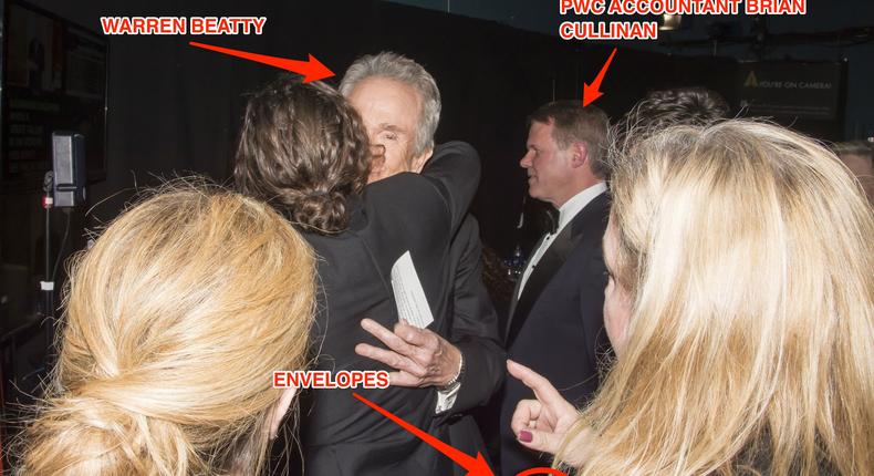 Warren Beatty backstage at the 2017 Oscars hugging Casey Affleck, before he was handed the wrong envelope by PricewaterhouseCoopers accountant Brian Cullinan.