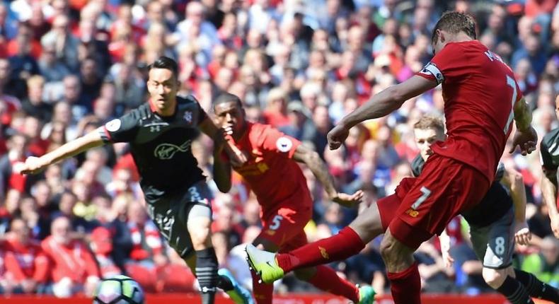 Liverpool's midfielder James Milner takes a penalty during the English Premier League football match between Liverpool and Southampton at Anfield in Liverpool, north west England on May 7, 2017