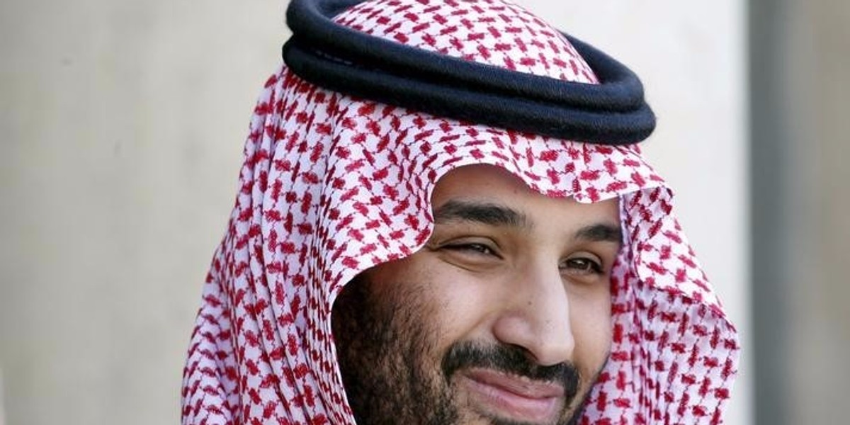 Saudi Arabia's Deputy Crown Prince Mohammed bin Salman reacts upon his arrival at the Elysee Palace in Paris