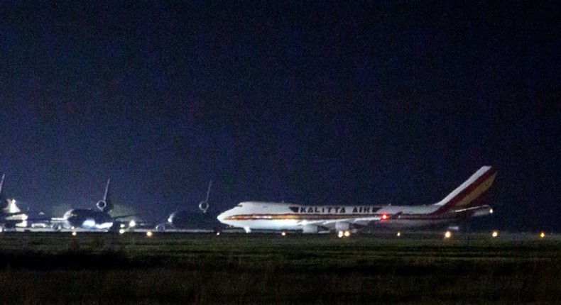 A plane carrying American passengers, who were released from the Diamond Princess cruise ship in Japan, arrives at Travis Air Force Base in California on February 16