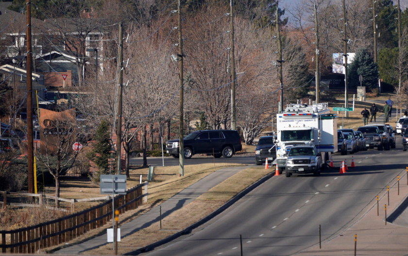 A vehicle leaves the Copper Canyon apartments, the scene of the incident where deputies and civilian