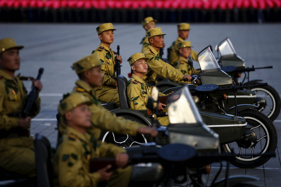 Soldiers ride motorcycles past a stand with North Korean leader Kim Jong Un during the parade celebrating the 70th anniversary of the founding of the ruling Workers' Party of Korea.