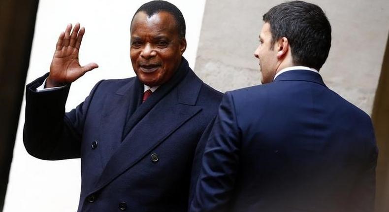 Congo's President Denis Sassou Nguesso waves as he arrives to attend a meeting with Italy's Prime Minister Matteo Renzi at Chigi Palace in Rome February 26, 2015. REUTERS/Tony Gentile