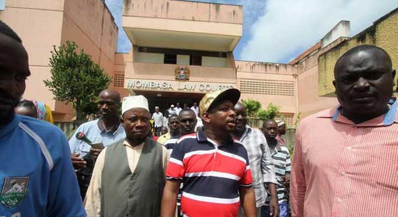 Nairobi Senator Mike Mbuvi Sonko (second right) leaves the Mombasa Law Courts on June 12, 2017 after he was discharged from being surety for the fugitive Mombasa Republican Council leader Omar Mwamnuadzi. 