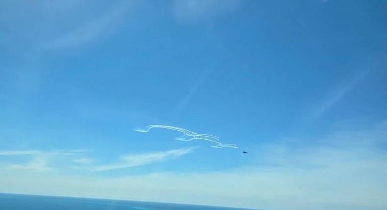 A Philippine Coast Guard image that it says shows a Chinese fighter jet firing flares.Philippine Coast Guard/X