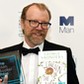 George Saunders, author of 'Lincoln in the Bardo', poses for photographers after winning the Man Booker Prize for Fiction 2017 in London