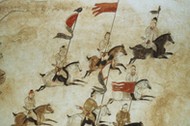 Murals picturing soldiers on horseback on the wall of the