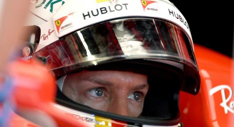 Ferrari's Sebastian Vettel sits in his car during practice for the Monaco Grand Prix, on May 25, 2017