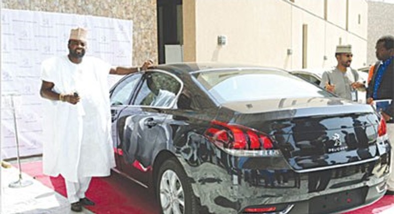 Kunle Afolayan, with his new Peugeot 508