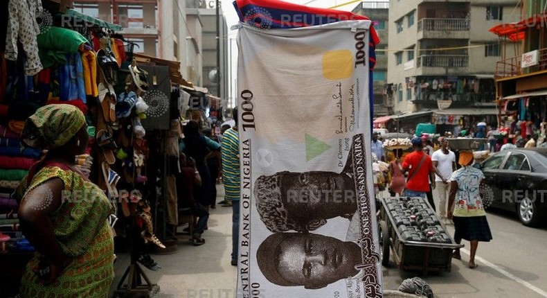 A towel with a print of the Nigerian naira is displayed for sale at a street market in the central business district in Nigeria's commercial capital Lagos February 4, 2016. 