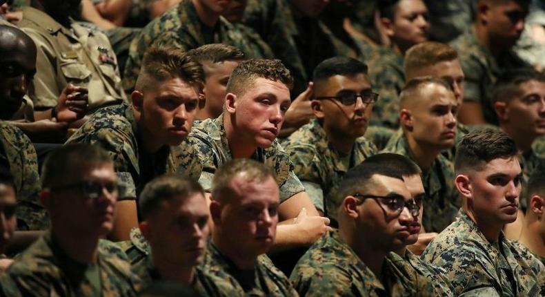 Members of the US military listen to Trump's speech