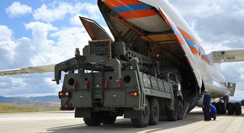 The first parts of a Russian S-400 system are unloaded at an airport near Ankara in July 2019.Turkish Military/Turkish Defence Ministry/Handout via REUTERS