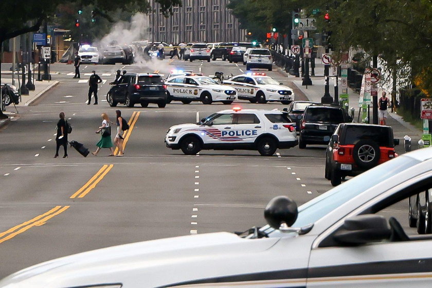 Police officers stop a suspect after a shooting incident outside of the White House, in Washington