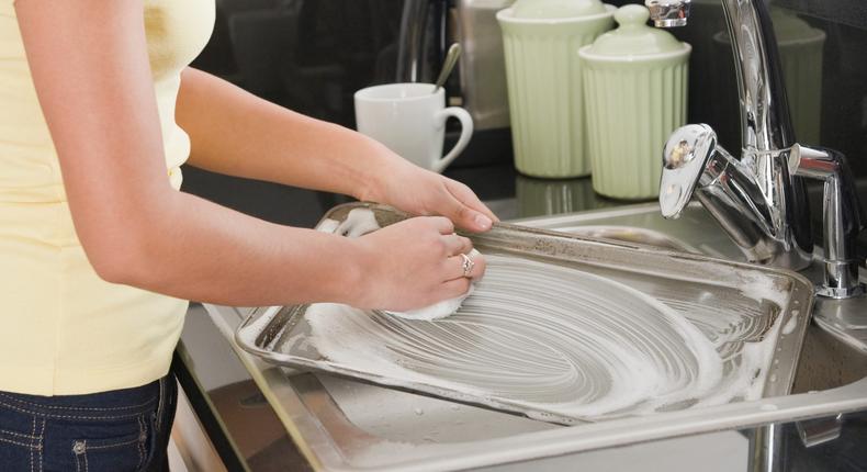 For most messes, hot water and dish soap followed with a thorough drying should clean a baking sheet.JGI/Jamie Grill/Getty Images