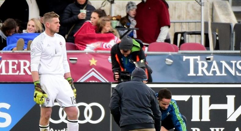 Jordan Morris of Seattle Sounders receives attention from staff in front of goaltender Zac MacMath of Colorado Rapids after an injury during his goal for a 1-0 lead at Dick's Sporting Goods Park on November 27, 2016