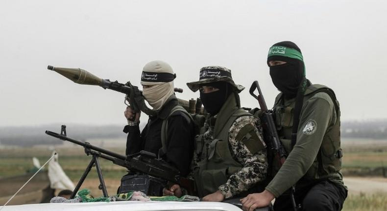 Members of the Ezzedine al-Qassam Brigades, the militant wing of the Palestinian Islamist movement Hamas, patrol in the southern Gaza Strip