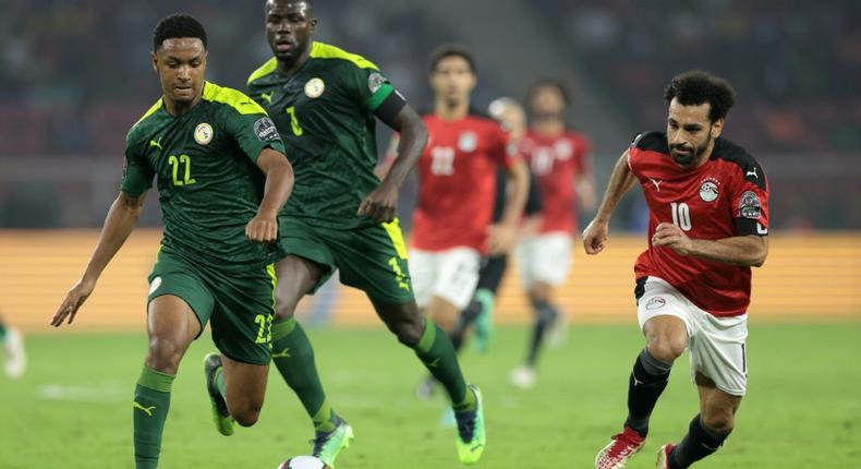 Egypt captain Mohamed Salah (R) chases after the ball during the Africa Cup of Nations final against Senegal in Yaounde on February 6.