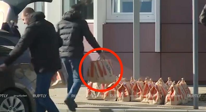 A still image shows KFC-branded bags piled up outside the Soluxe Hotel in Moscow, Russia, on March 20, 2023, while Chinese leader Xi Jinping was staying there.Ruptly/Insider