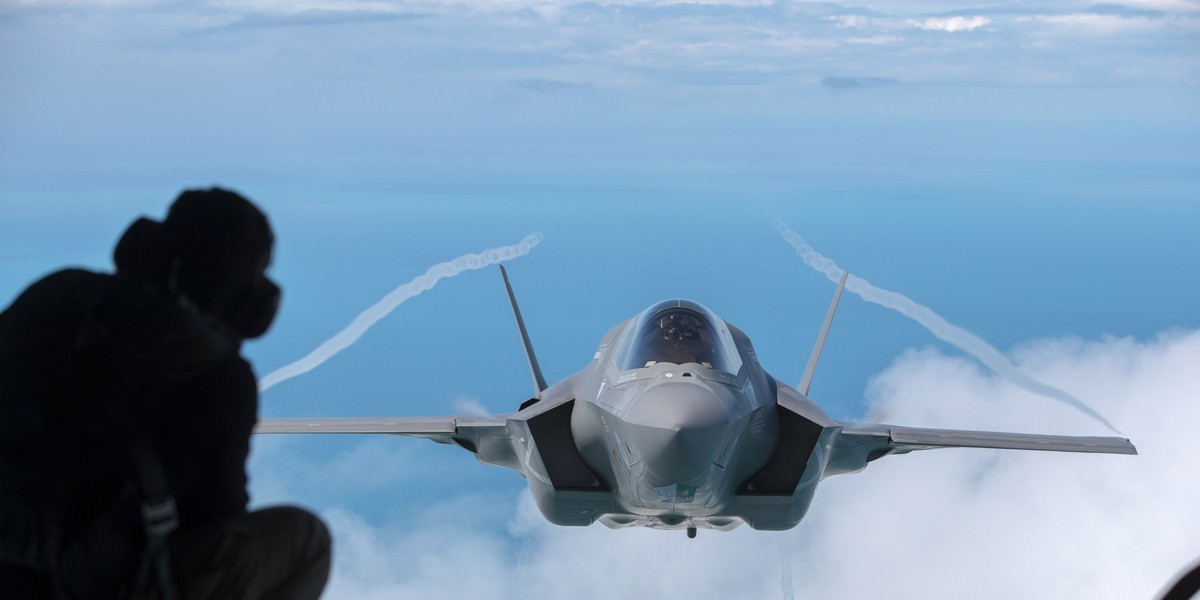 A F-35B aircraft approaches a KC-130J Super Hercules aircraft to refuel as it flies over the North Sea, having taken off from RAF Fairford on July 1, 2016.