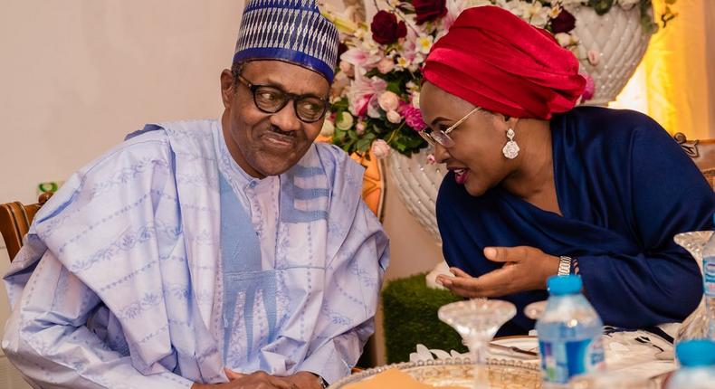 President Buhari and his wife Aisha, do some whispering (Presidency) 